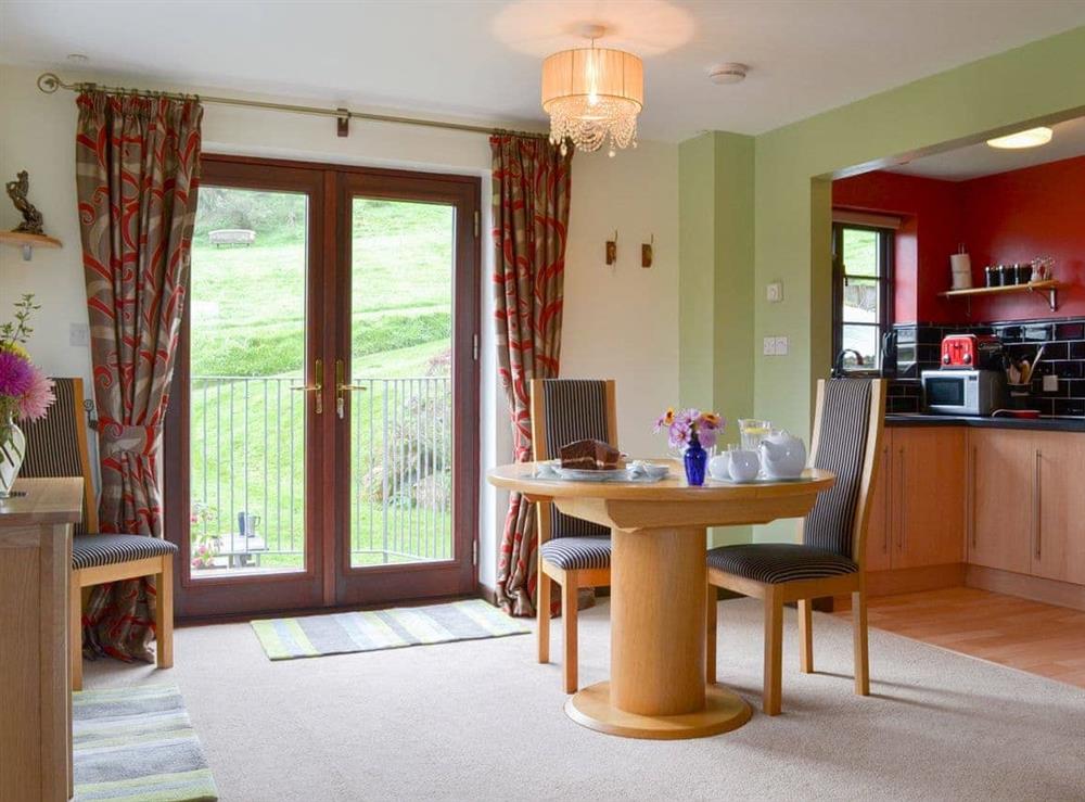 Modest dining area next to the patio doors at Tripp Cottage in St Neot, near Liskeard, Cornwall
