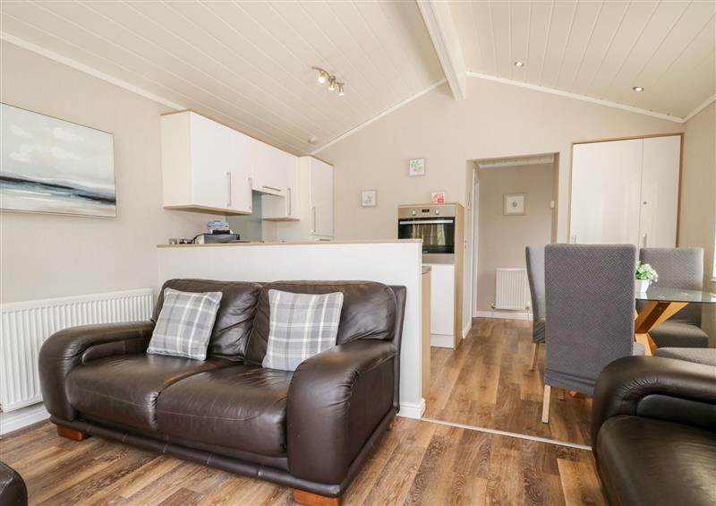 Relax in the living area at Troutbeck Lodge, Beckside 6