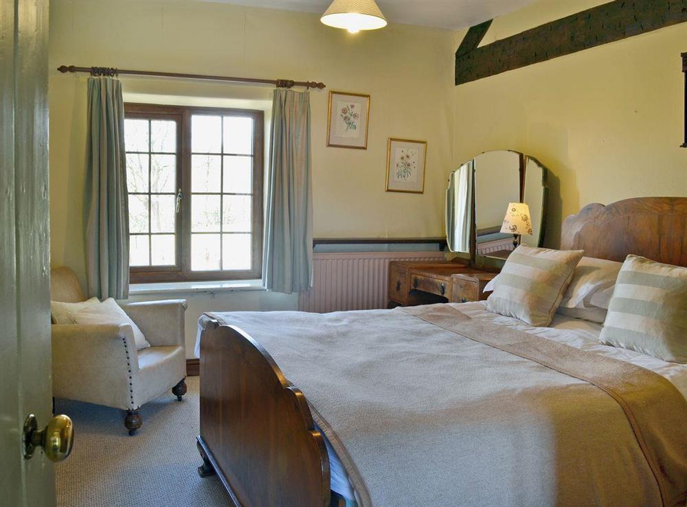 Elegant double bedroom at Trowley Farmhouse in near Painscastle, Hay-on-Wye, Powys
