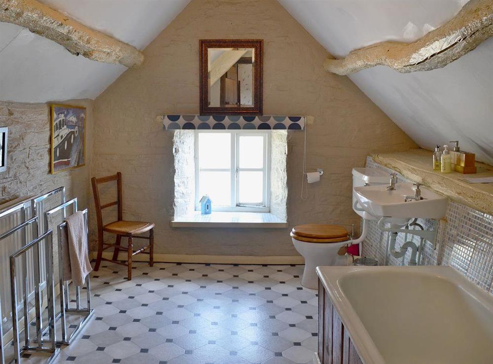 Large bathroom with bath and WC at Trowley Farmhouse in near Painscastle, Hay-on-Wye, Powys