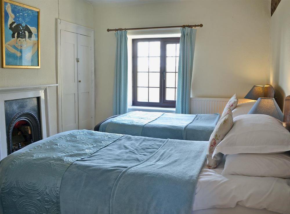 Twin bedroom with original features at Trowley Farmhouse in near Painscastle, Hay-on-Wye, Powys