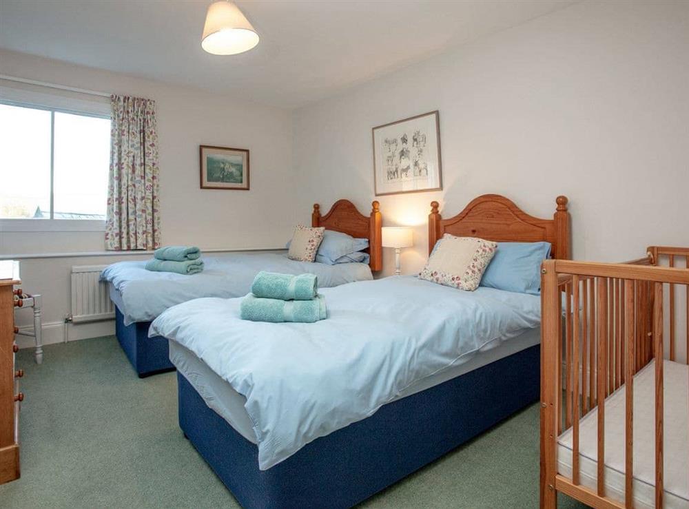 Twin bedroom with cot at Tuckenhay Mill House in Bow Creek, Nr Totnes, South Devon., Great Britain