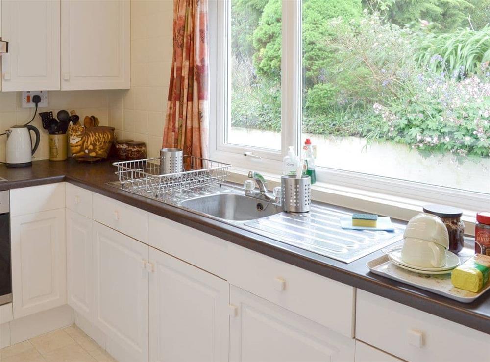 Well-equipped kitchen with garden views at Tucstan in Constantine, near Falmouth, Cornwall