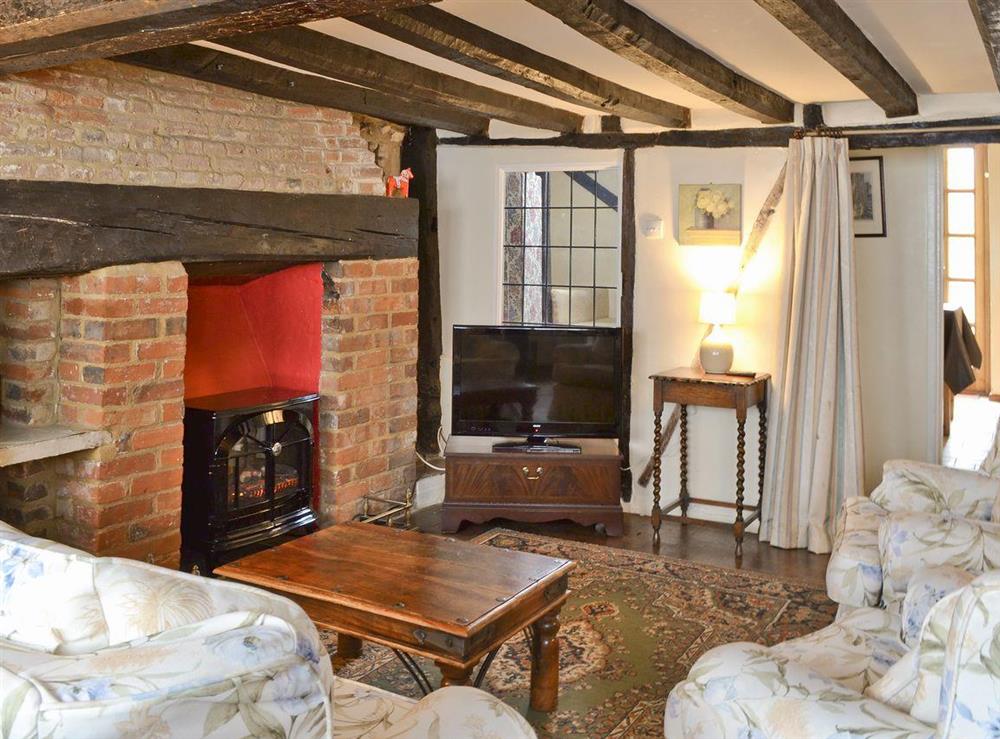 Charming beamed living/dining room at Tudor Cottage in Romsey, Hampshire