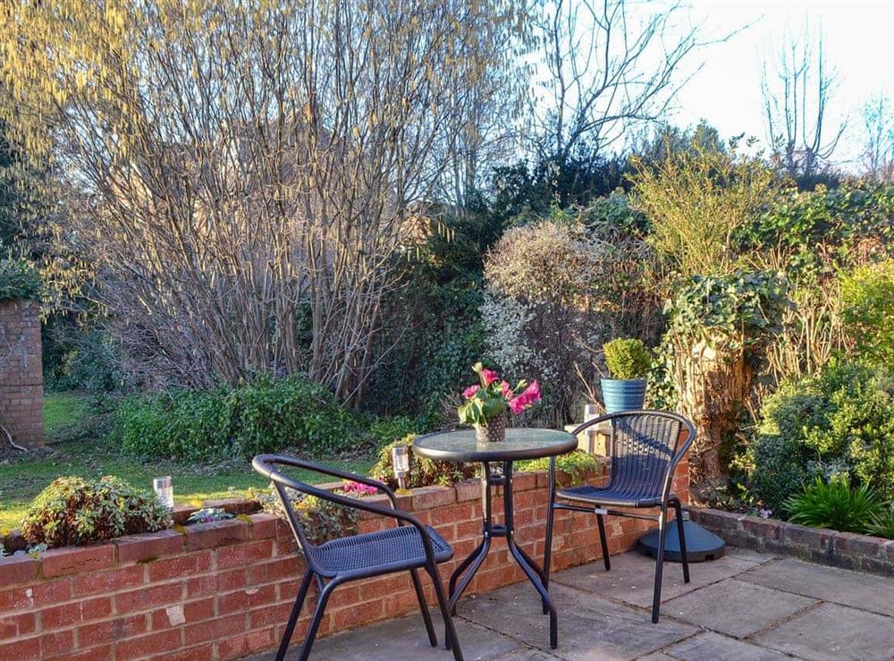 Charming table and chairs on the patio at Tudor Cottage in Romsey, Hampshire