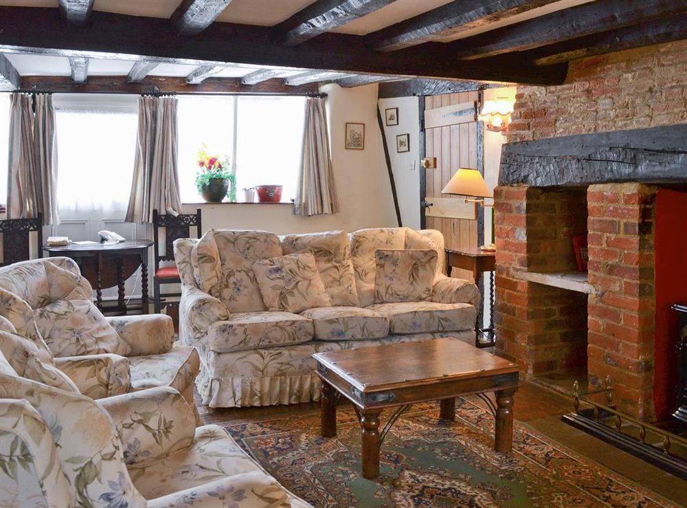 Living/dining room with many original features at Tudor Cottage in Romsey, Hampshire