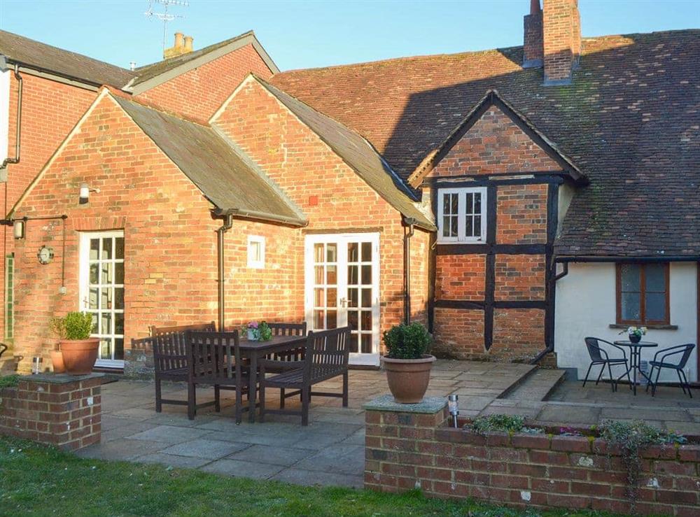 Shared patio area and garden at Tudor Cottage in Romsey, Hampshire