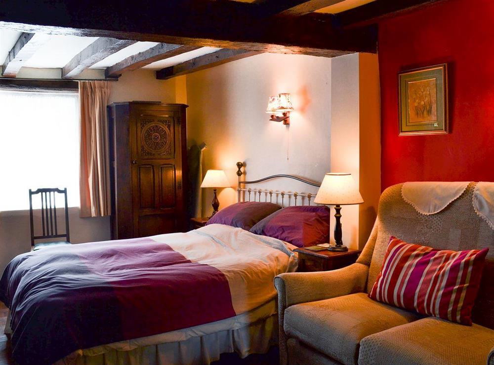 Lovely double bed in the sleeping area at Tudor Cottage Studio in Romsey, Hampshire