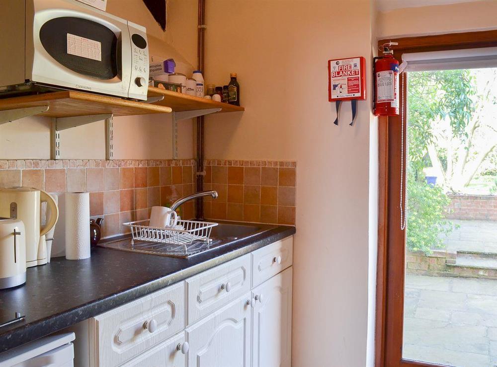 Modest kitchen area at Tudor Cottage Studio in Romsey, Hampshire