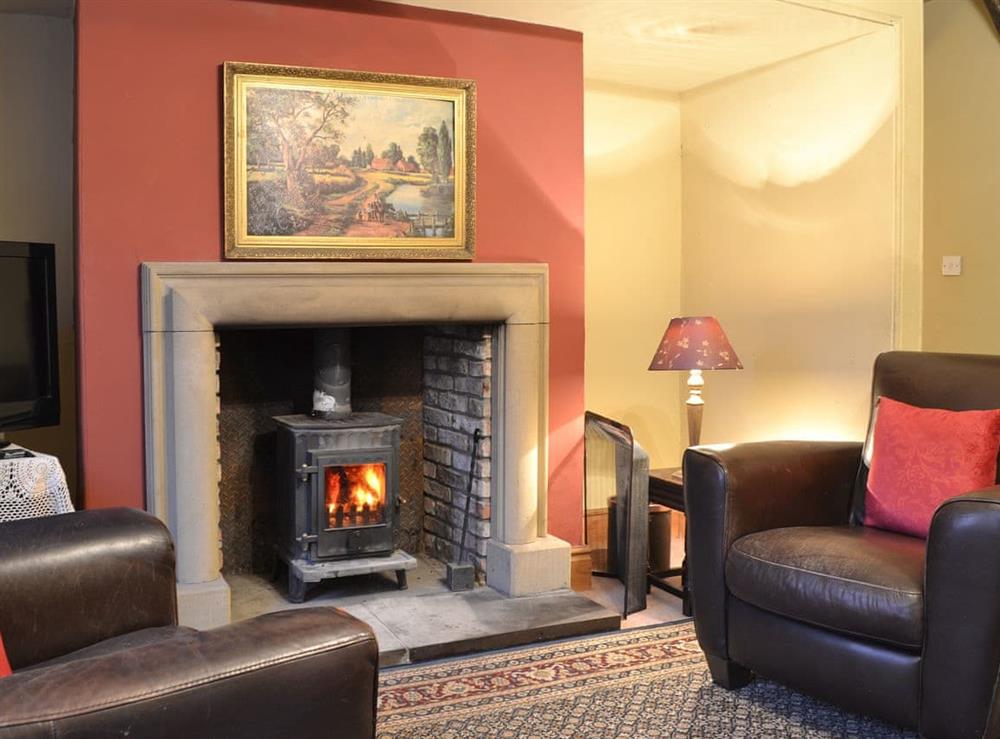 Cosy living room with wood burner at Tudor House in Easingwold, near York, North Yorkshire