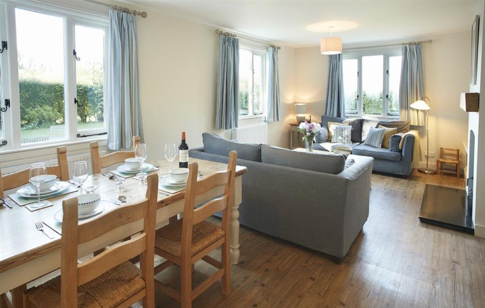 Open plan sitting and dining table seating four guests at Tufton Croft, Wittersham