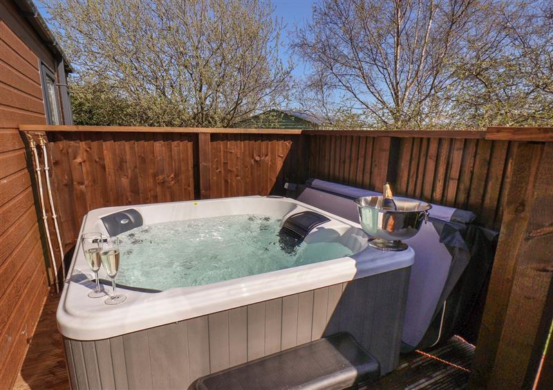 Enjoy the hot tub at Tulip Lodge, Runswick Bay near Staithes