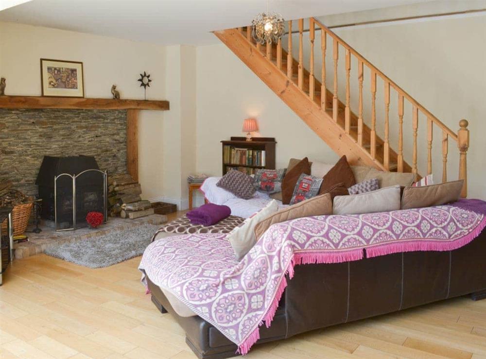 Spacious living area with feature fireplace at Tulip Lodge in Tideford Cross, near Saltash, Cornwall