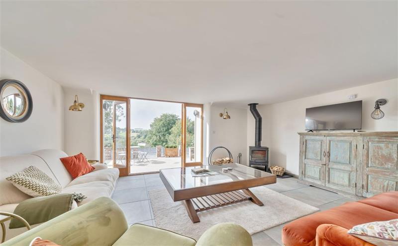 Relax in the living area at Tumbledown Barn, Knowstone
