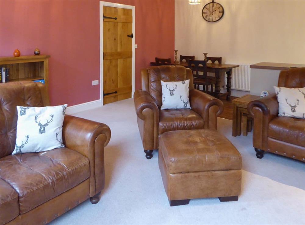 Comfortable leather furniture at Tuppence Cottage in Dulverton, Somerset