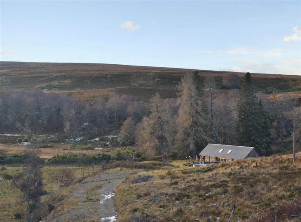Secluded accommodation accessed via a woodland track at Turin Nurin Cottage in Tomatin, near Inverness, Inverness-Shire