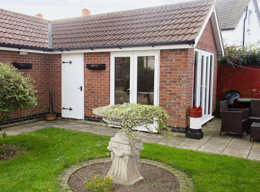 Small lawned garden and furniture at Twenty in Sutton-on-Sea, Mablethorpe, Lincolnshire