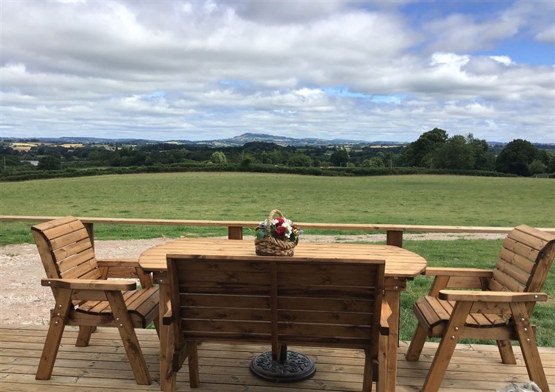 Enjoy a glass of wine on the patio at Twilight, Raglan