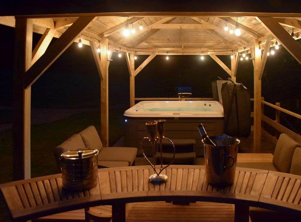 A romantic spot by the hot tub at Twisly North Lodge in Catsfield, near Battle, Sussex, East Sussex