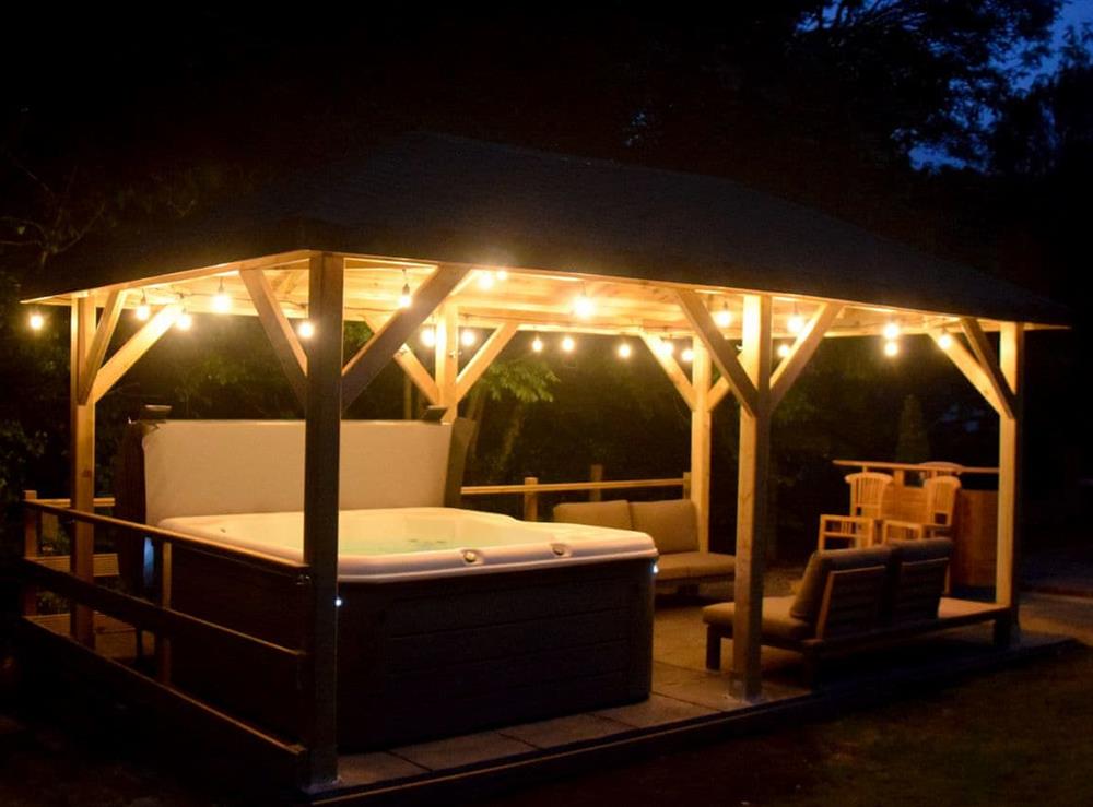 Outdoor socialising area by night at Twisly North Lodge in Catsfield, near Battle, Sussex, East Sussex