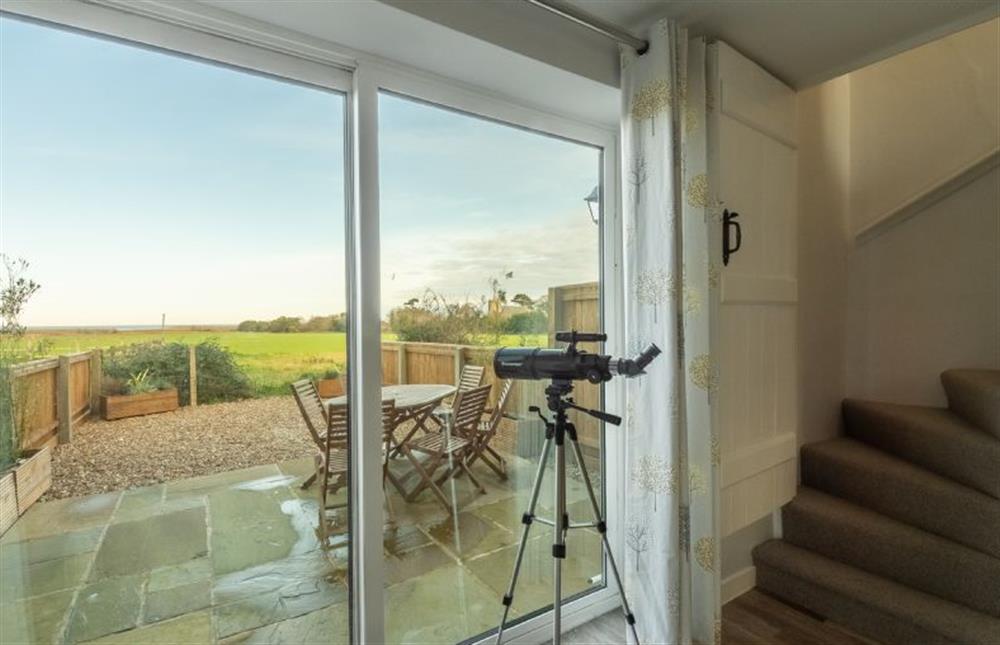 Doors lead out onto the garden and terrace which provide fabulous views of the coast at Twitchers Cottage, Titchwell near Kings Lynn