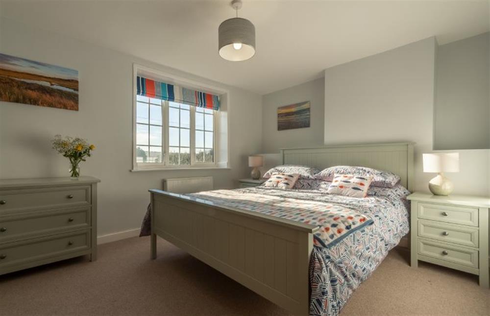 First floor: King-size bedroom is light and bright at Twitchers Cottage, Titchwell near Kings Lynn