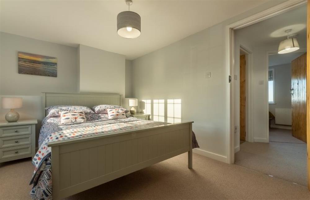 First floor: King-size bedroom at Twitchers Cottage, Titchwell near Kings Lynn