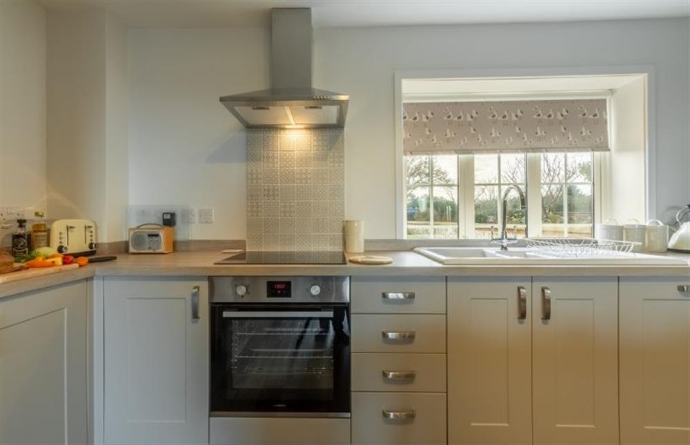 Ground floor: Kitchen with integrated appliances at Twitchers Cottage, Titchwell near Kings Lynn