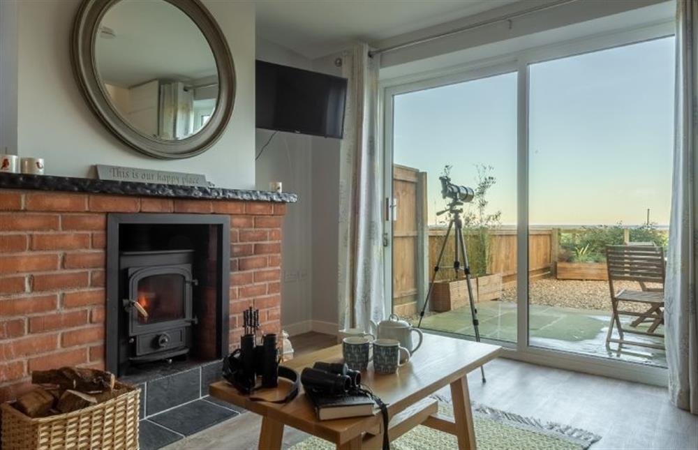 Ground floor:  Light the wood burning stove on winter evenings at Twitchers Cottage, Titchwell near Kings Lynn