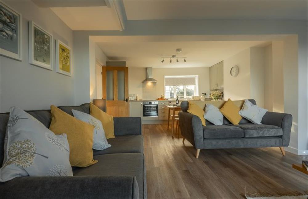 Ground floor: Sitting area is relaxing with two large sofas at Twitchers Cottage, Titchwell near Kings Lynn
