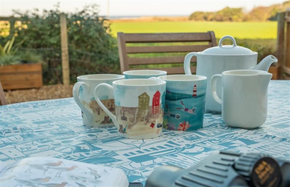 Outside: Rear garden with patio set - ideal for watching wildlife with a cup of tea at Twitchers Cottage, Titchwell near Kings Lynn