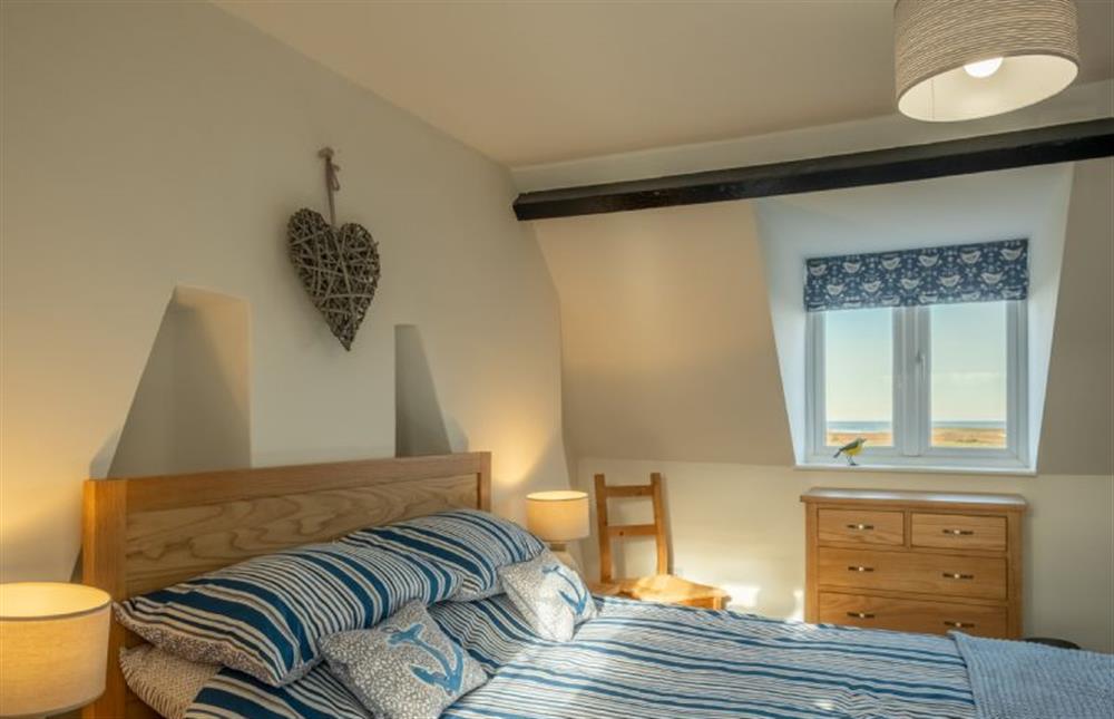 Second floor: King-size bedroom  at Twitchers Cottage, Titchwell near Kings Lynn
