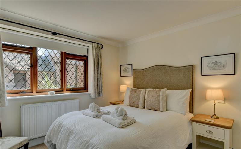 One of the bedrooms at Two Grooms Cottage, Dunster