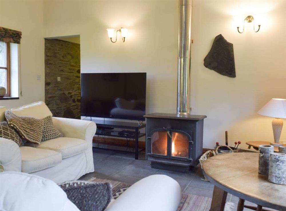 Cosy living area with wood burner at Ty Bach in Fachongle Ganol, Nr Newport, Pembs., Dyfed