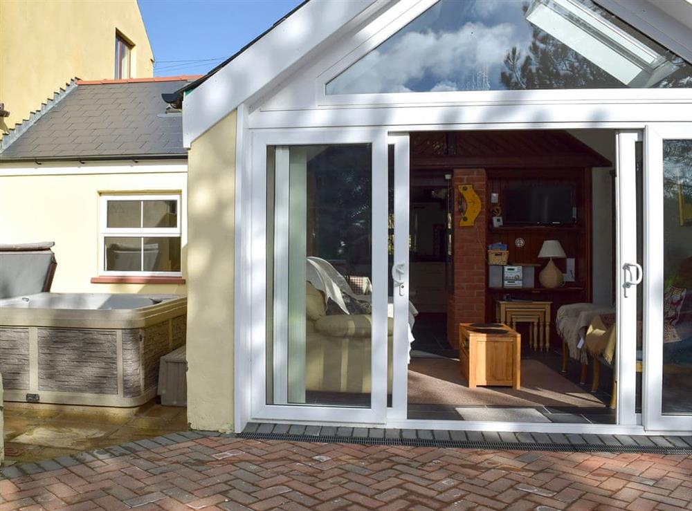 Enclosed patio with hot tub at Ty Cameron in near Dwrbach, Fishguard, Dyfed