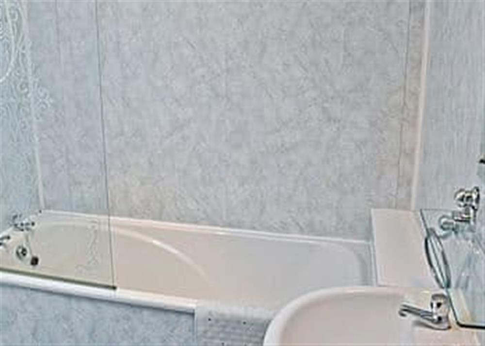 Bathroom with shower over bath at Ty Canol in Rhiw, near Aberdaron, Gwynedd