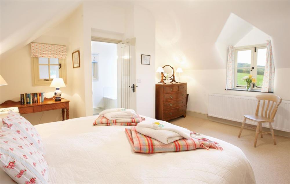 Twin bedroom with two 3’ zip and link beds which can convert to 6’ double upon request at Ty Cerrig, Bodnant Estate