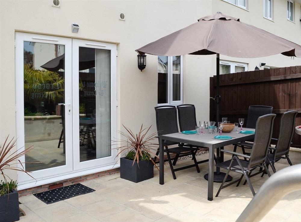 Outdoor dining area with BBQ at Ty Cerrig in Cwmgors, near Ammanford, Glamorgan, Dyfed