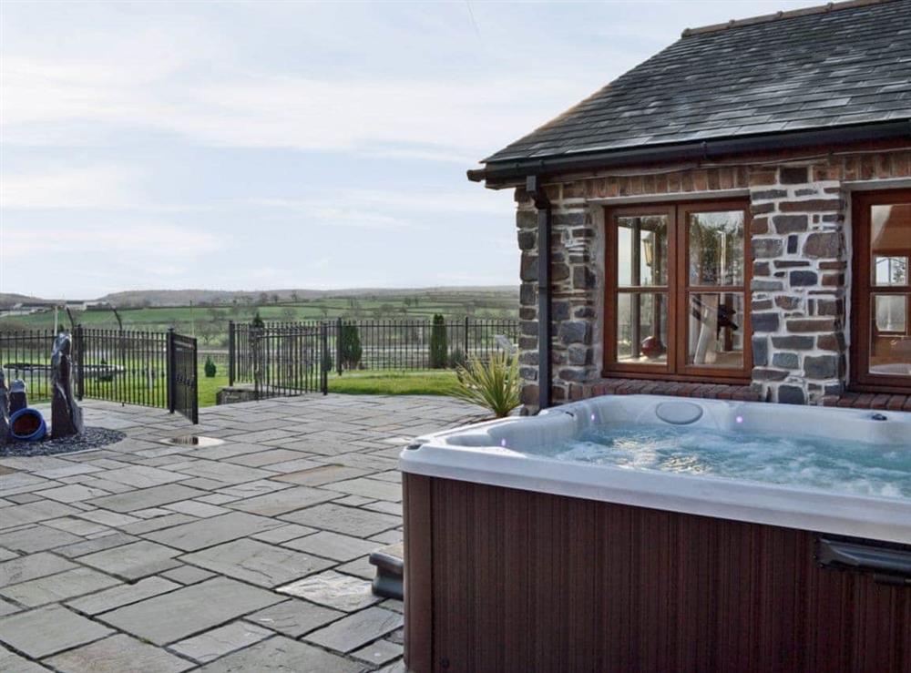 Hot tub at Ty Cerrig Farmhouse in St Clears, near Laugharne, Dyfed