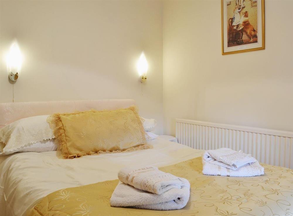 Relax in the comfortable double bedroom at Ty Coch Cottage in Near Aberaeron, Dyfed