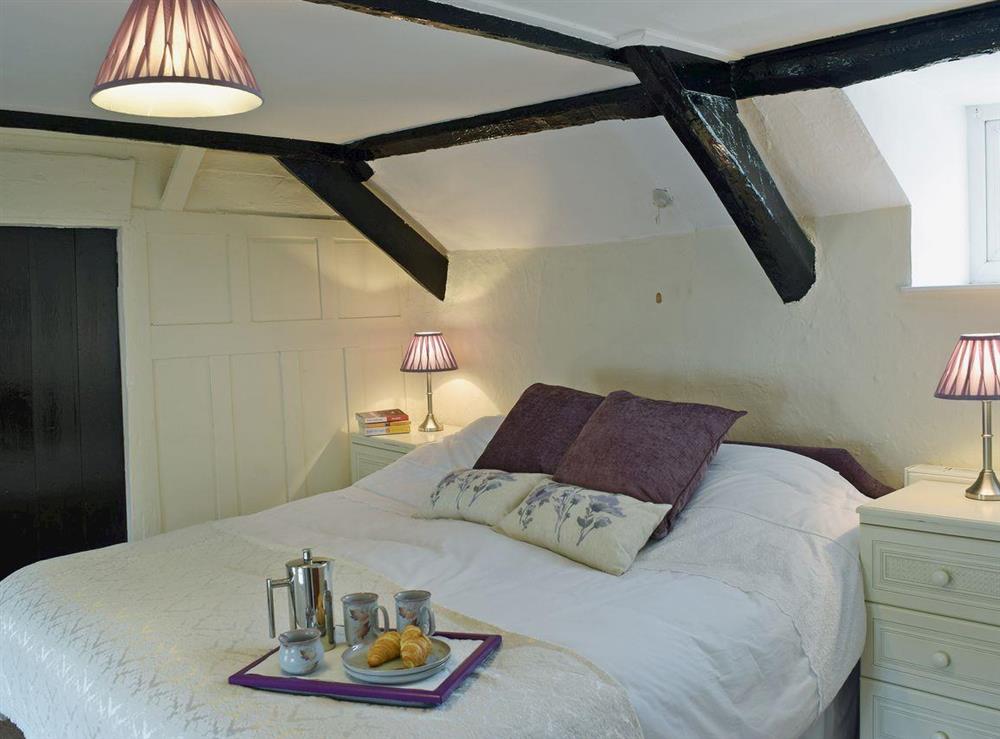 Comfortable double bedroom full of character at Ty Cornel in Aberporth, near Cardigan, Dyfed