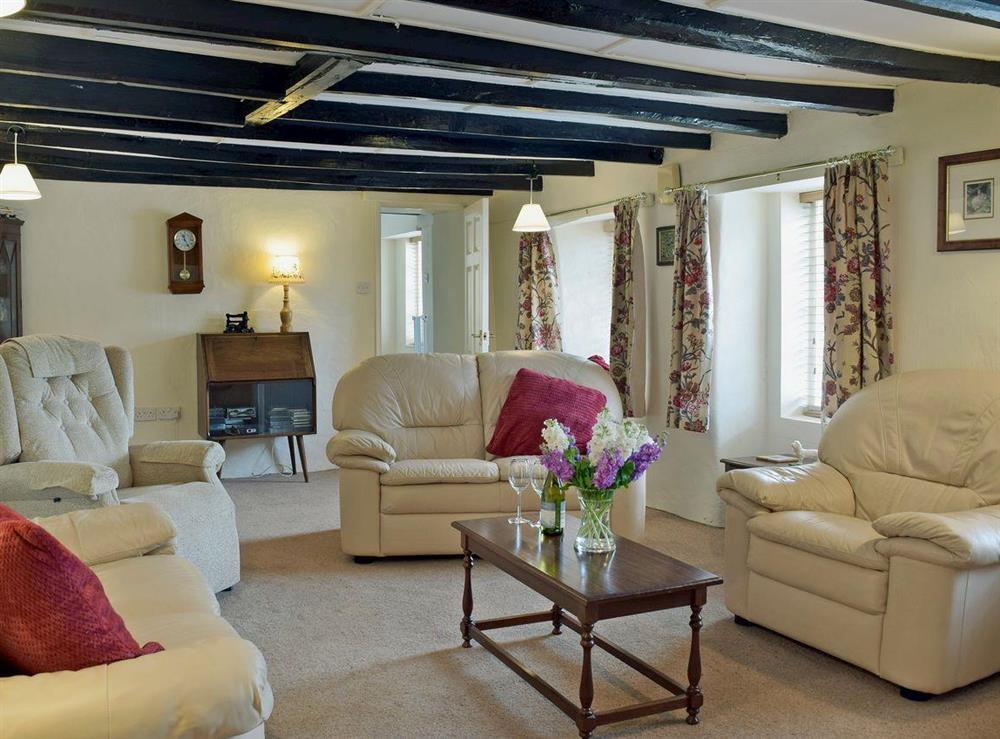 Spacious living room with beams (photo 2) at Ty Cornel in Aberporth, near Cardigan, Dyfed