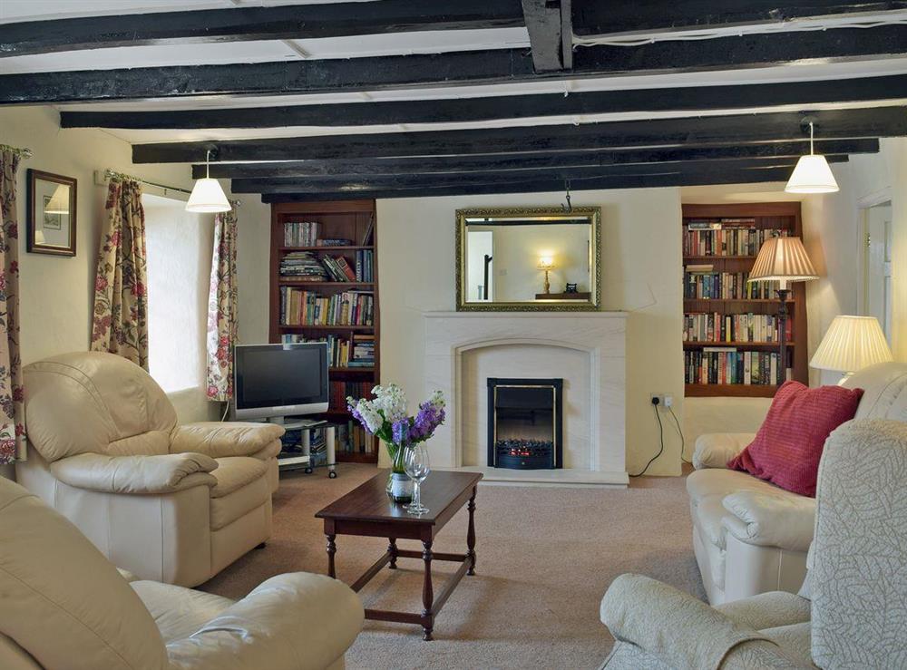 Spacious living room with beams at Ty Cornel in Aberporth, near Cardigan, Dyfed