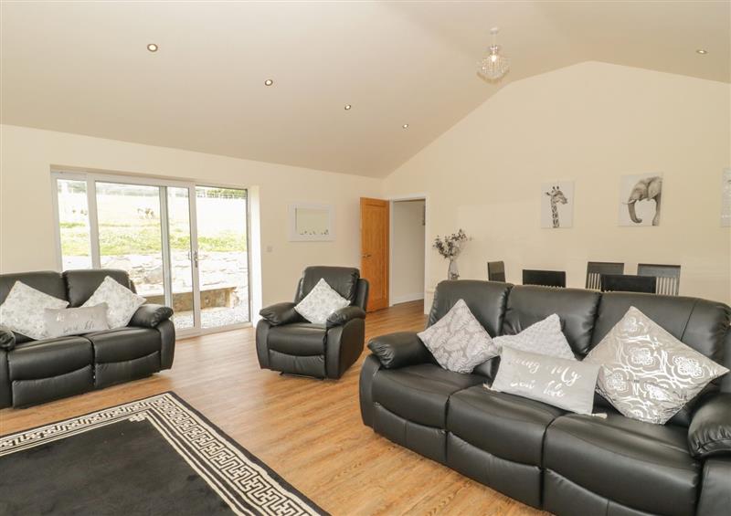 Relax in the living area at Ty Cuddfan, Llangoed