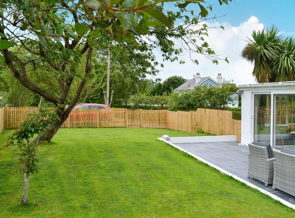 Enclosed lawned garden with patio, garden furniture and BBQ (photo 2) at Ty Gwyn in Cei Bach, near New Quay, Cardigan, Dyfed