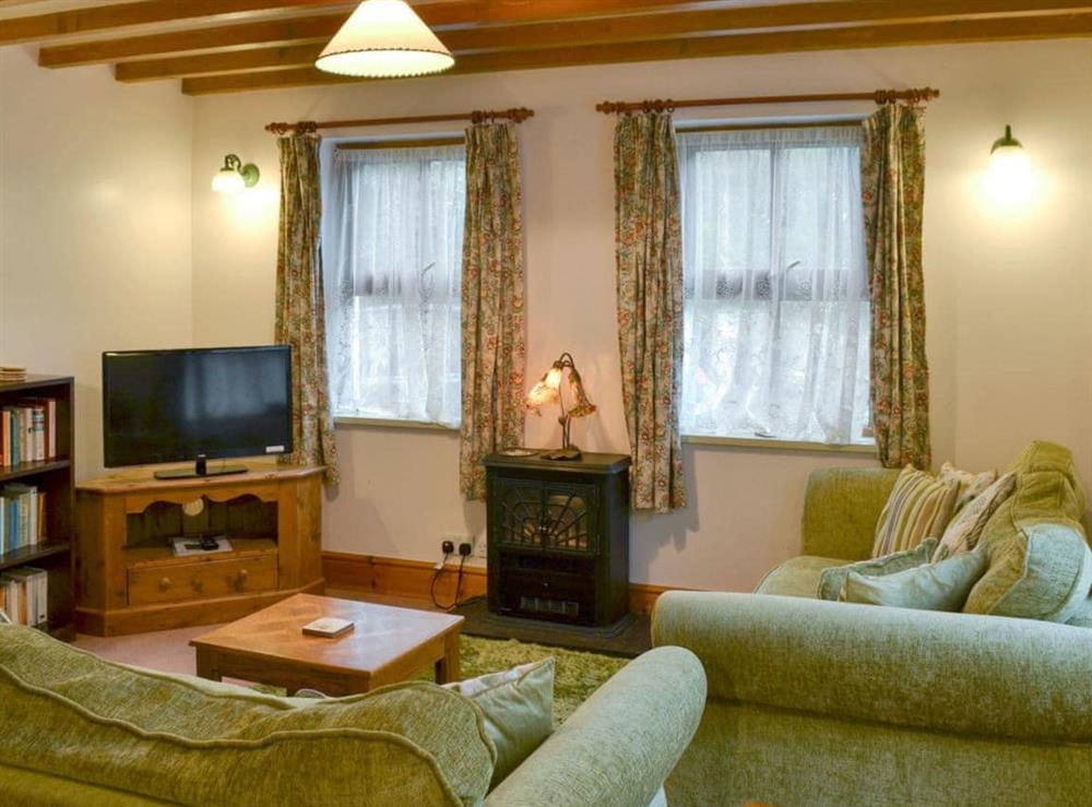 Charming living room with beamed ceiling at Ty Gwyn in Llanbedrgoch, Anglesey., Gwynedd