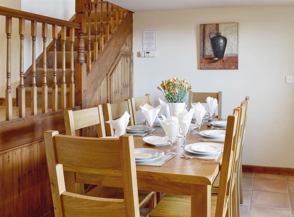 Heritage dining table and stairs to upper level at Ty Hir in Arthog, Fairbourne, Gwynedd