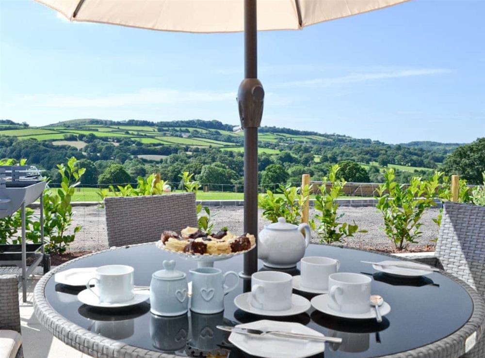 Outdoor dining area with great views at Ty Isaf Cottage in Trapp, near Llandeilo, Dyfed
