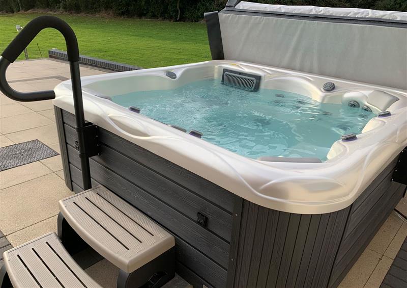 Spend some time in the hot tub at Ty Marlyn, Crofty