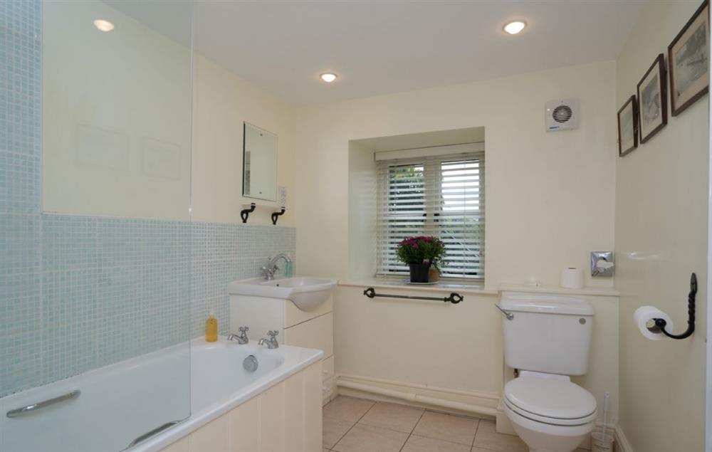 En suite bathroom with shower over the bath at Ty Newydd, Bodnant Estate